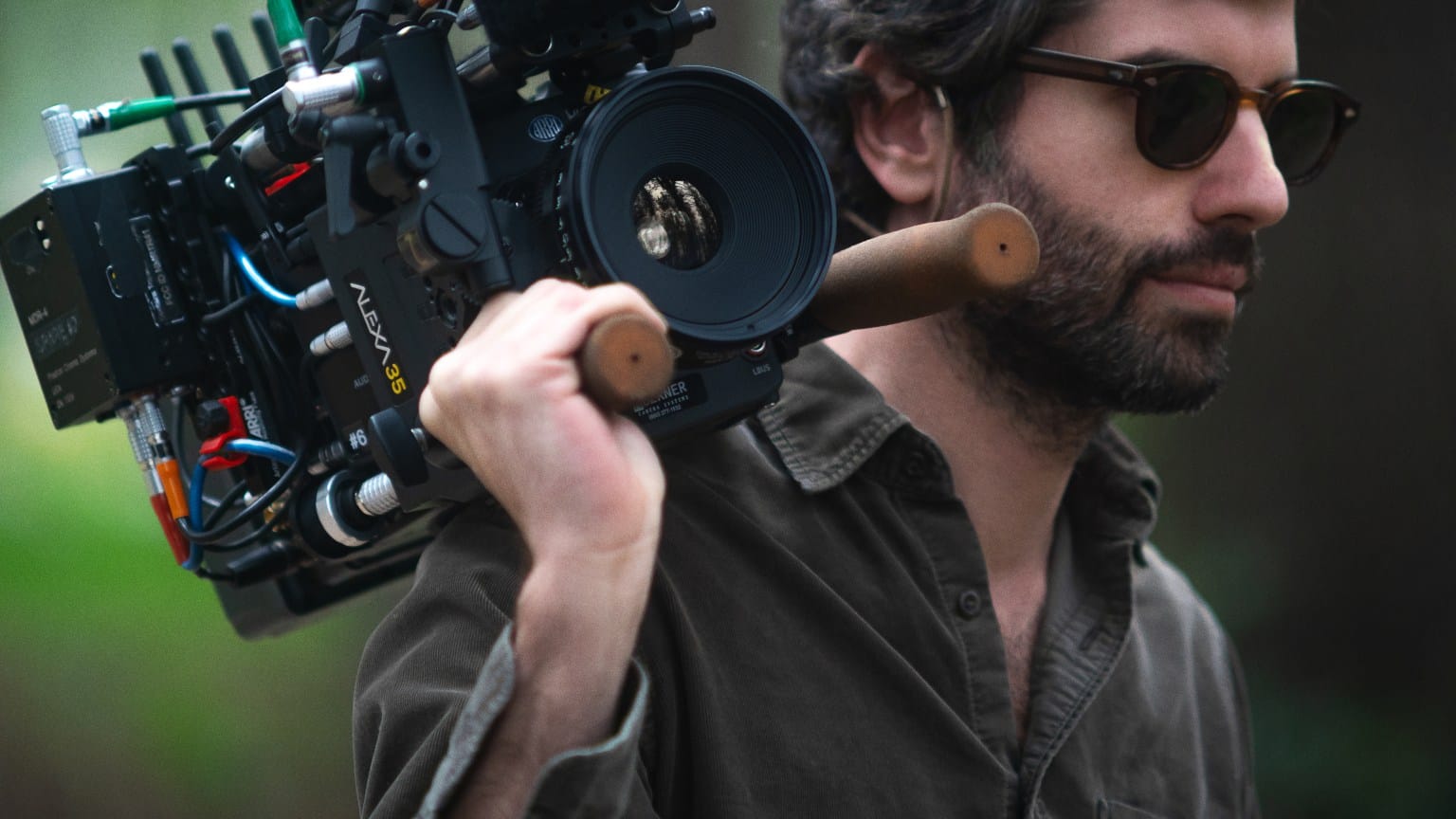 Adolpho Veloso carrying the camera on his shoulder on the Train Dreams set