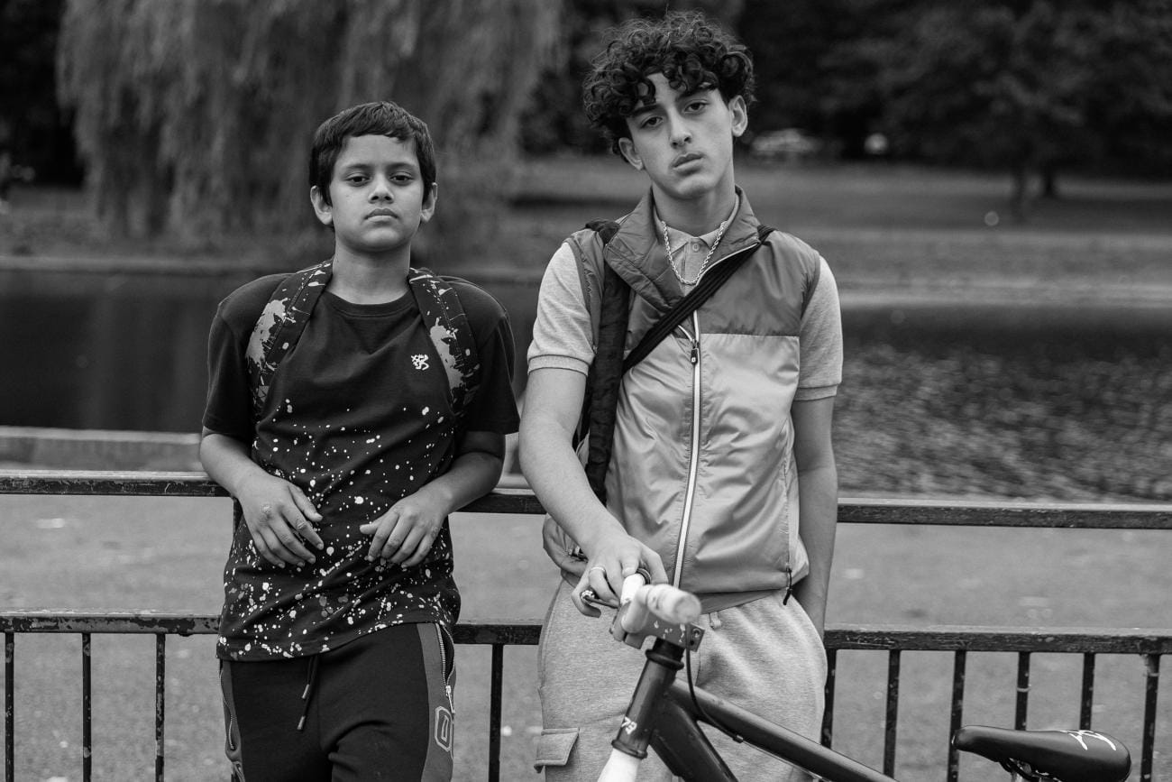 Farhan Hasnat and Yahya Kitana together beside a bicycle in Ish